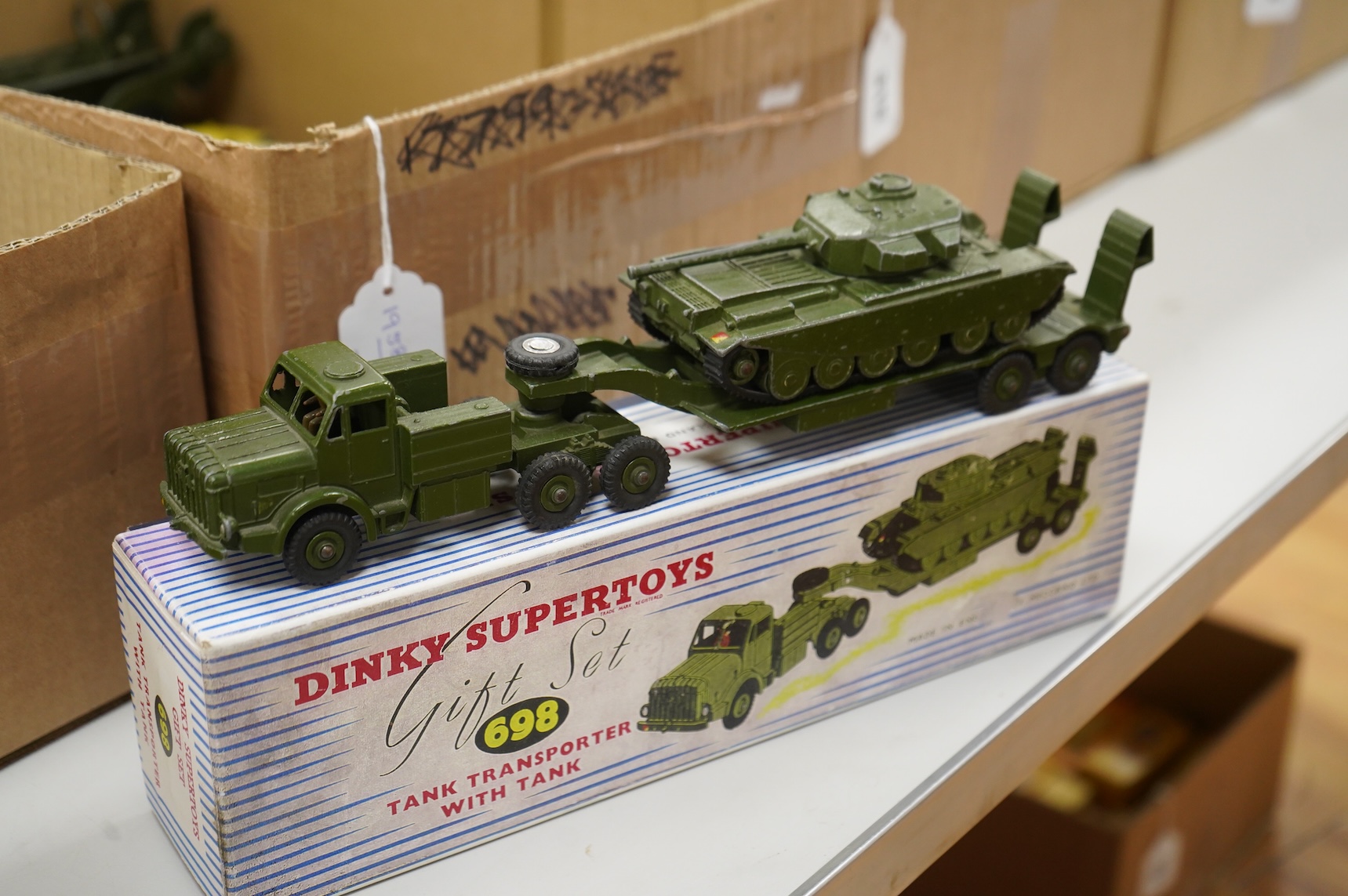 Twenty-three Dinky Toys and Supertoys, all playworn, restored, repainted or overpainted, (twelve in reproduction boxes), twelve aircraft, five Foden, 8-wheel commercial vehicles, a tank transporter with Centurion tank, a